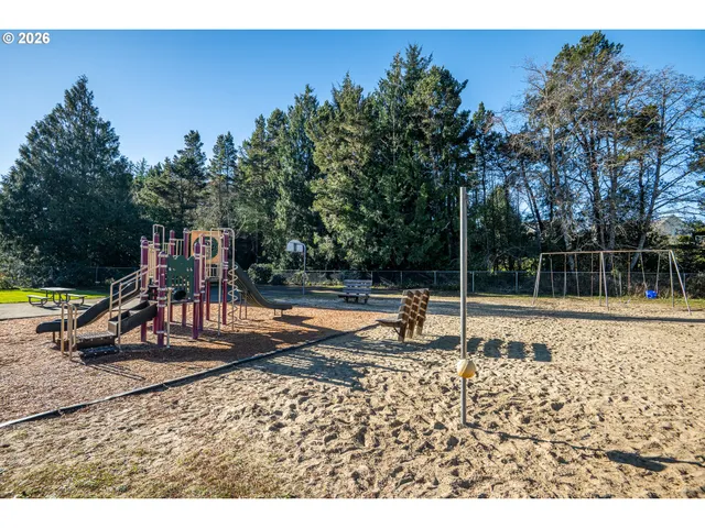 a view of a park with swings and slides