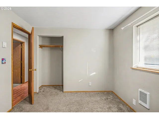 a room with window and closet