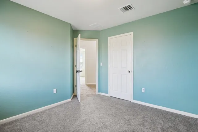 a bathroom with a sink a toilet and vanity