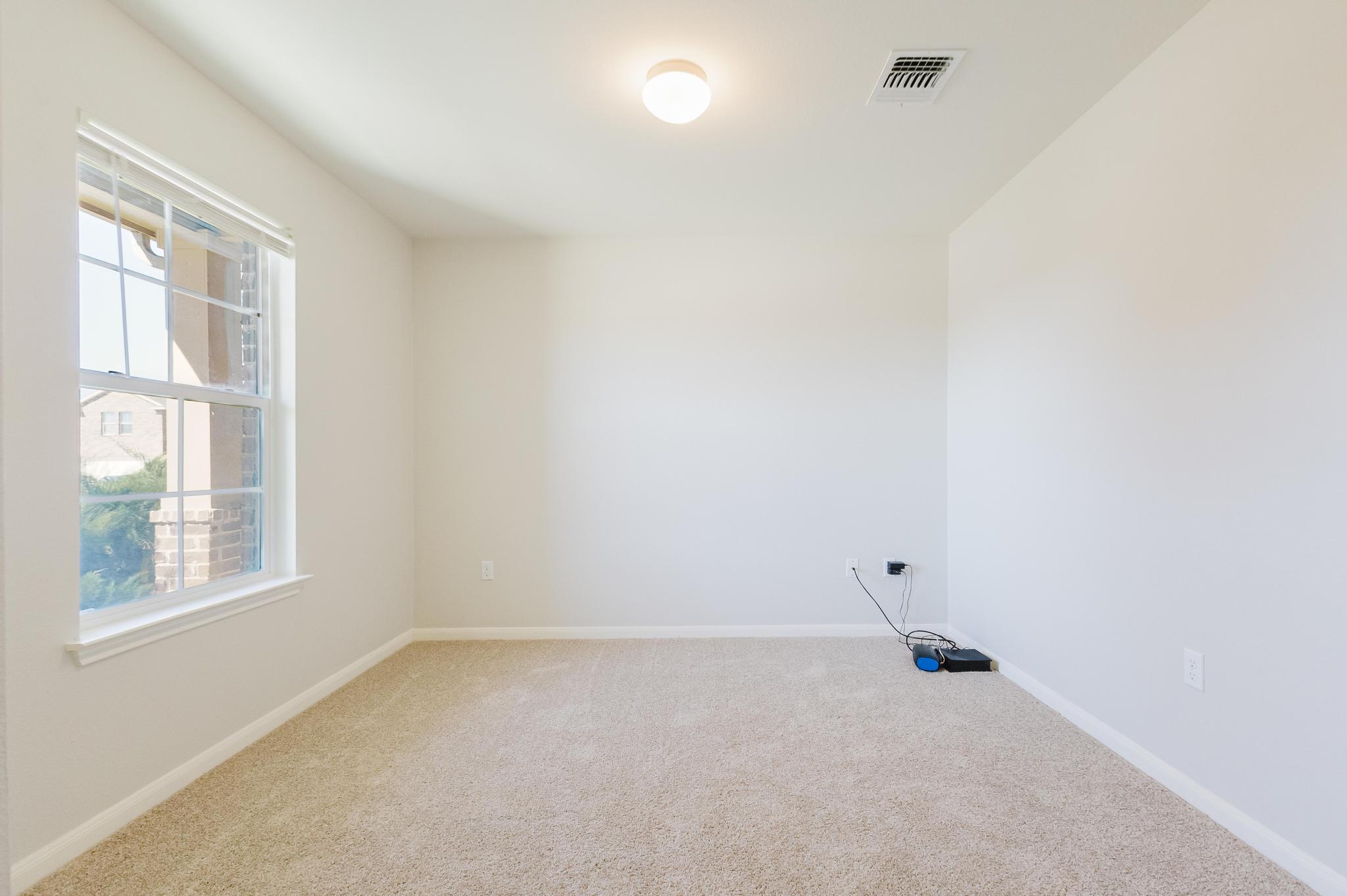 18316 Willow Sage Lane Elgin, TX 78621 - Photo 4 of 38 Office on the main floor at the front of the home.