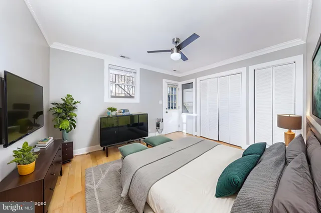 a bedroom with a bed and a couch