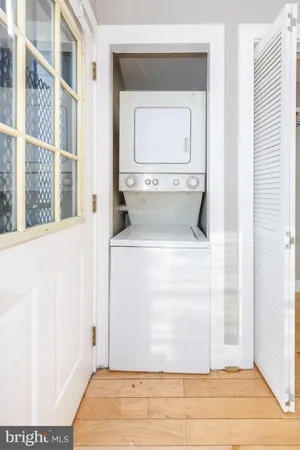 a view of a hallway with washer and dryer
