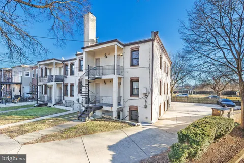 a view of a building with a yard