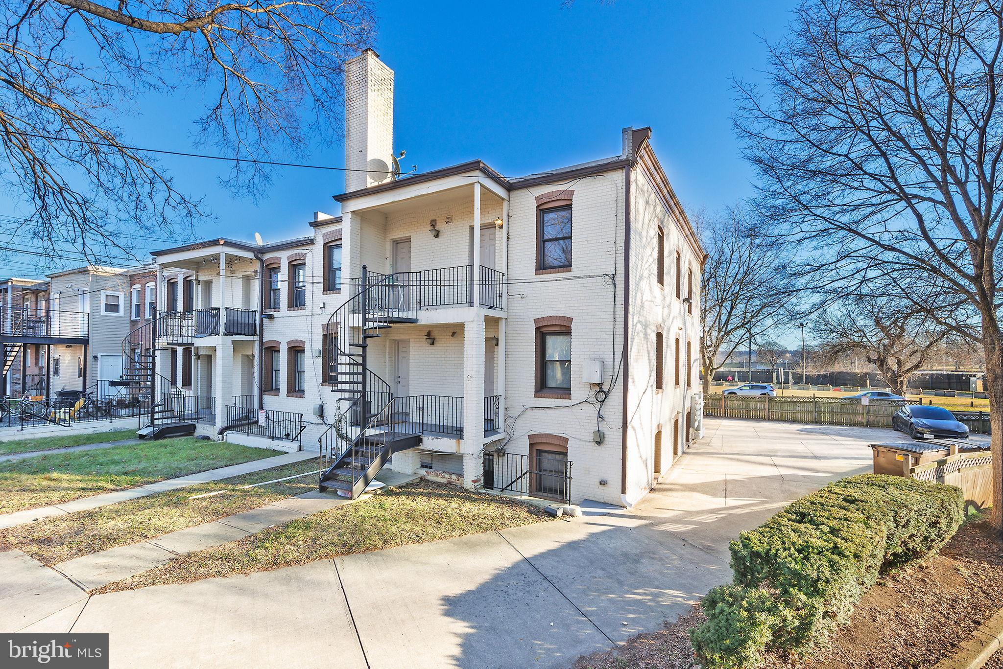 300 Oklahoma Avenue Northeast, Unit 101 Washington, DC 20002 - Photo 21 of 23 a view of a building with a yard