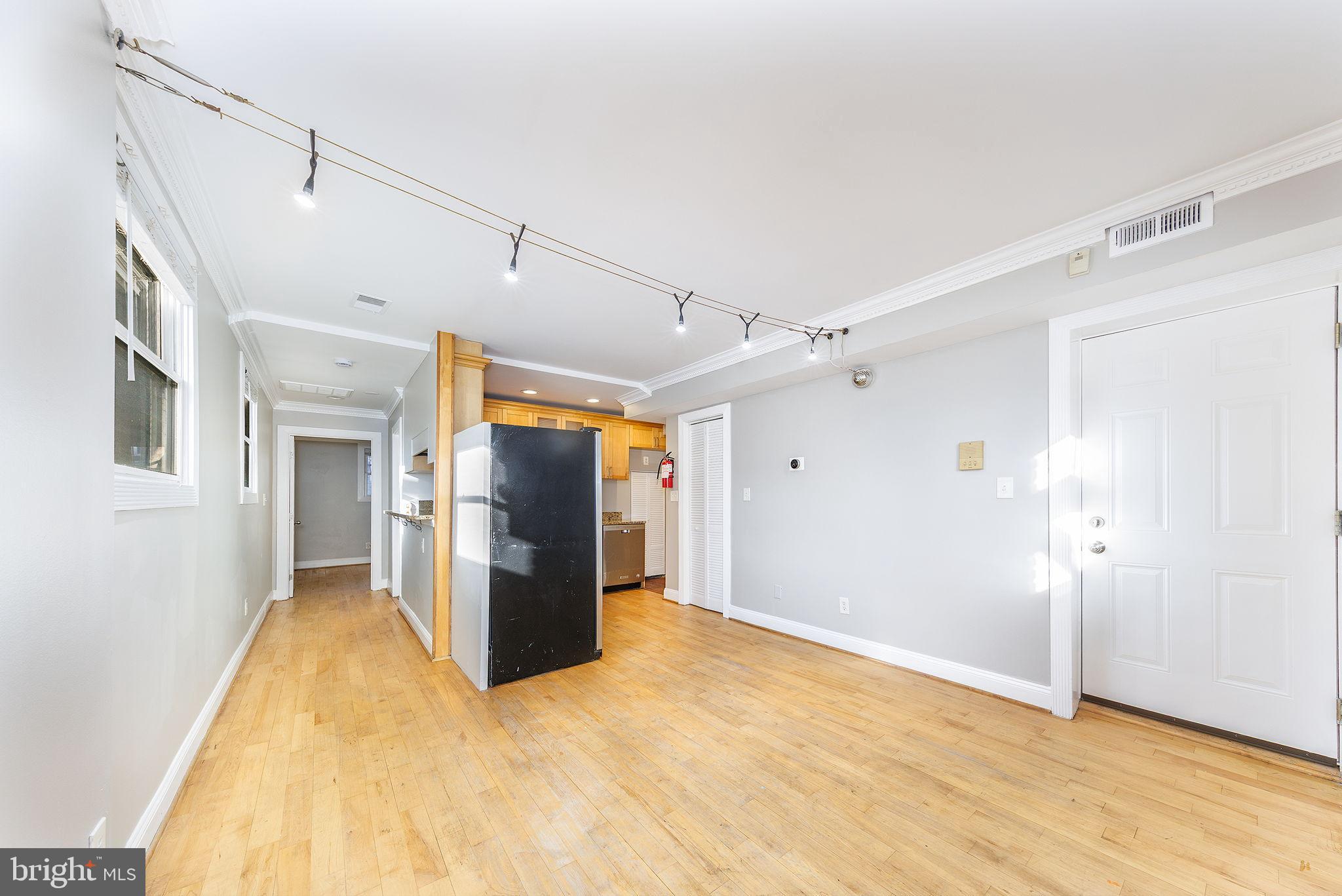 300 Oklahoma Avenue Northeast, Unit 101 Washington, DC 20002 - Photo 6 of 23 a view of a livingroom with wooden floor and a ceiling fan