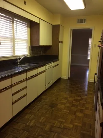 a bathroom with a sink a mirror and a bathtub
