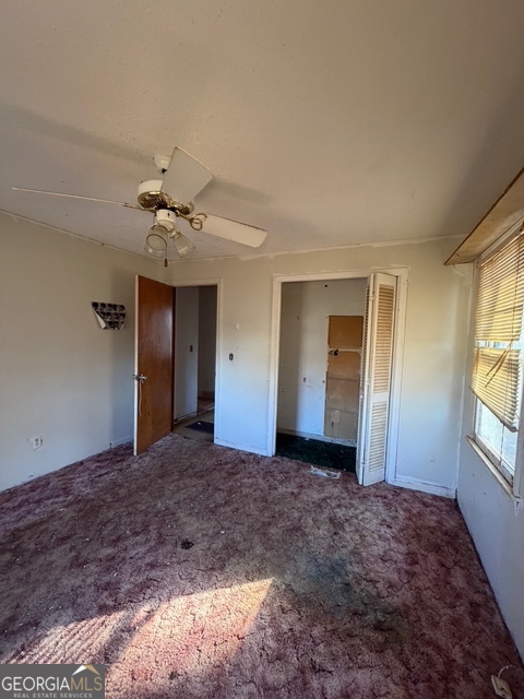 265 Griffin Road Martin, GA 30557 - Photo 6 of 20 a view of a livingroom with a chandelier fan and windows