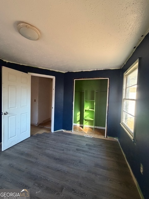 265 Griffin Road Martin, GA 30557 - Photo 8 of 20 a view of an empty room with window and wooden floor