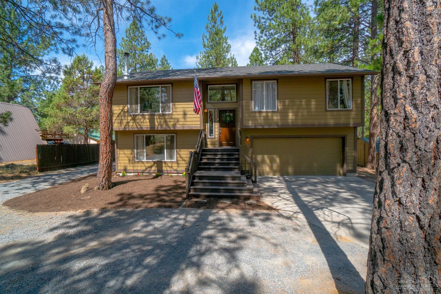 60175 Cheyenne Road Bend, OR 97702 - Photo 1 of 24 a front view of a house with a yard