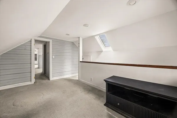 a view of an empty room with a fireplace