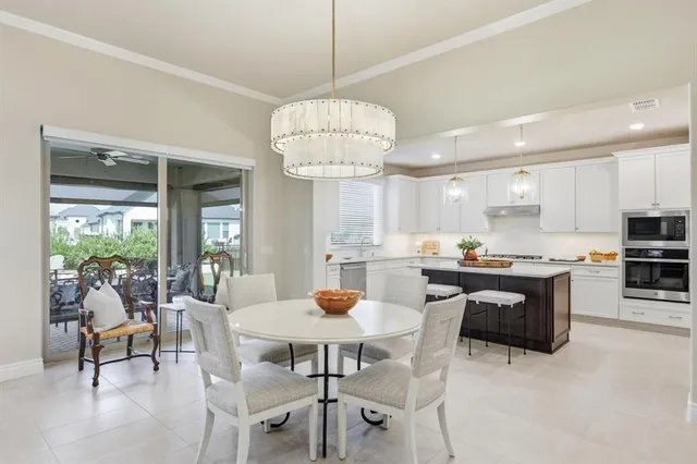 a kitchen with sink cabinets and refrigerator