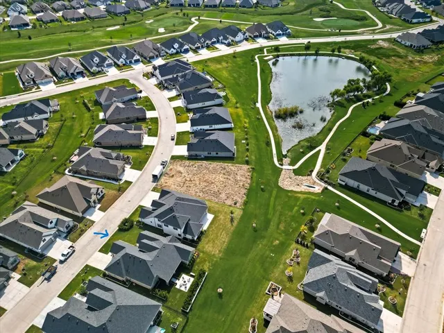 an aerial view of a house with a garden and trees
