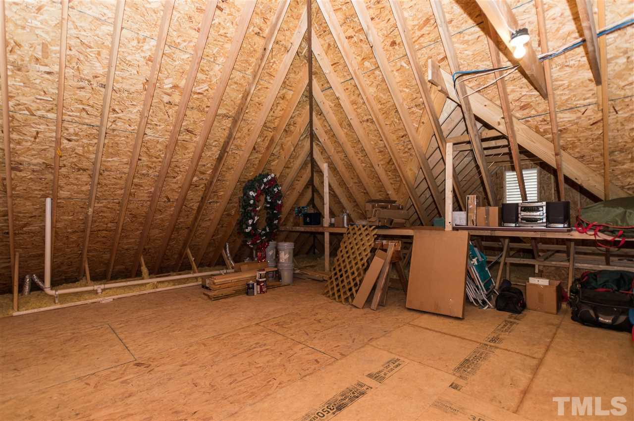 4805 Stoneyoak Lane Raleigh, NC 27610 - Photo 21 of 25 a view of a patio with a snow on the wall