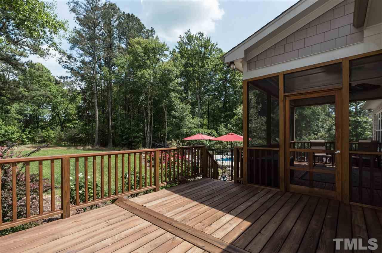 4805 Stoneyoak Lane Raleigh, NC 27610 - Photo 24 of 25 a view of backyard with deck and outdoor seating