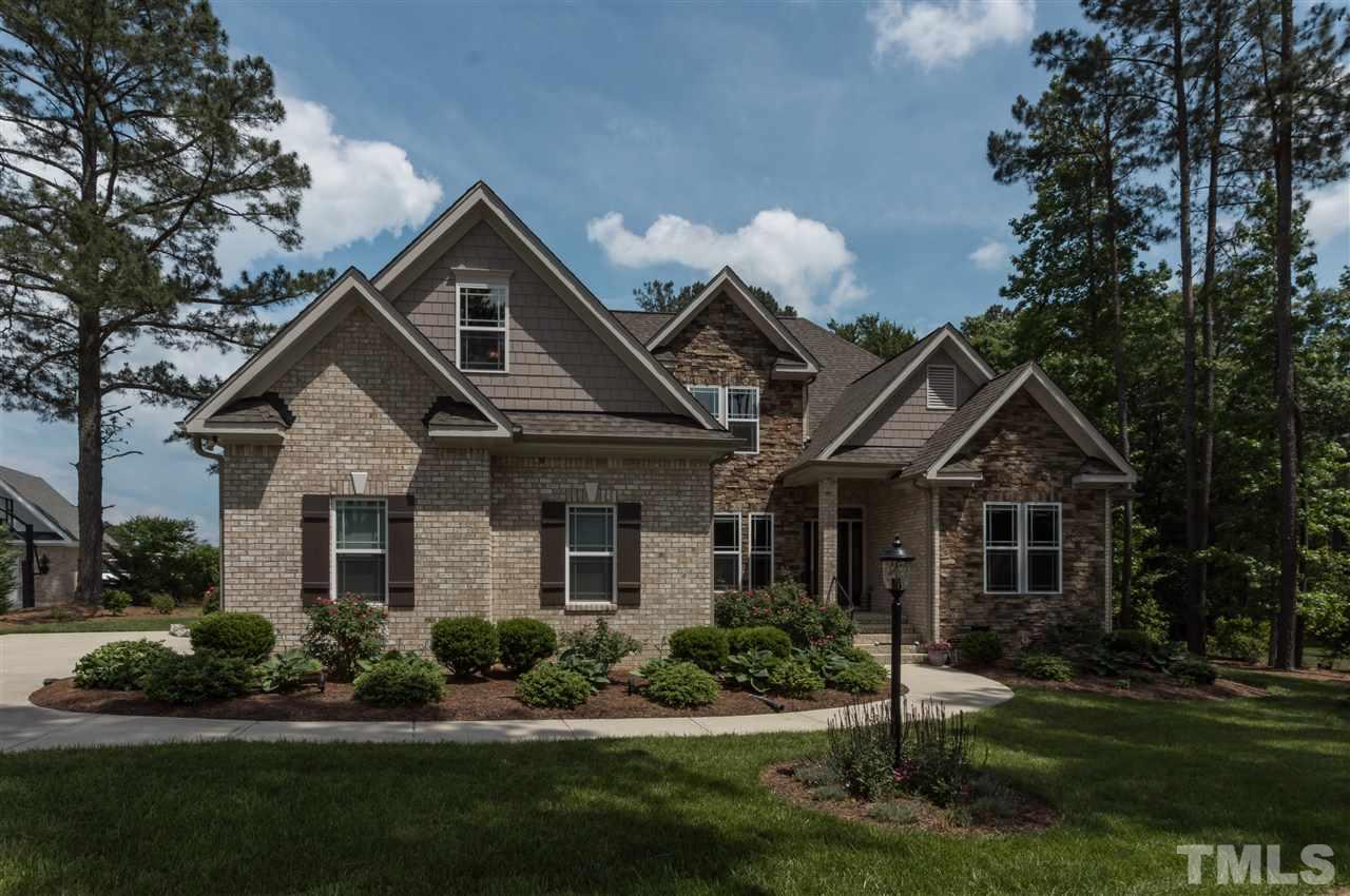 4805 Stoneyoak Lane Raleigh, NC 27610 - Photo 25 of 25 a front view of a house with a yard and green space