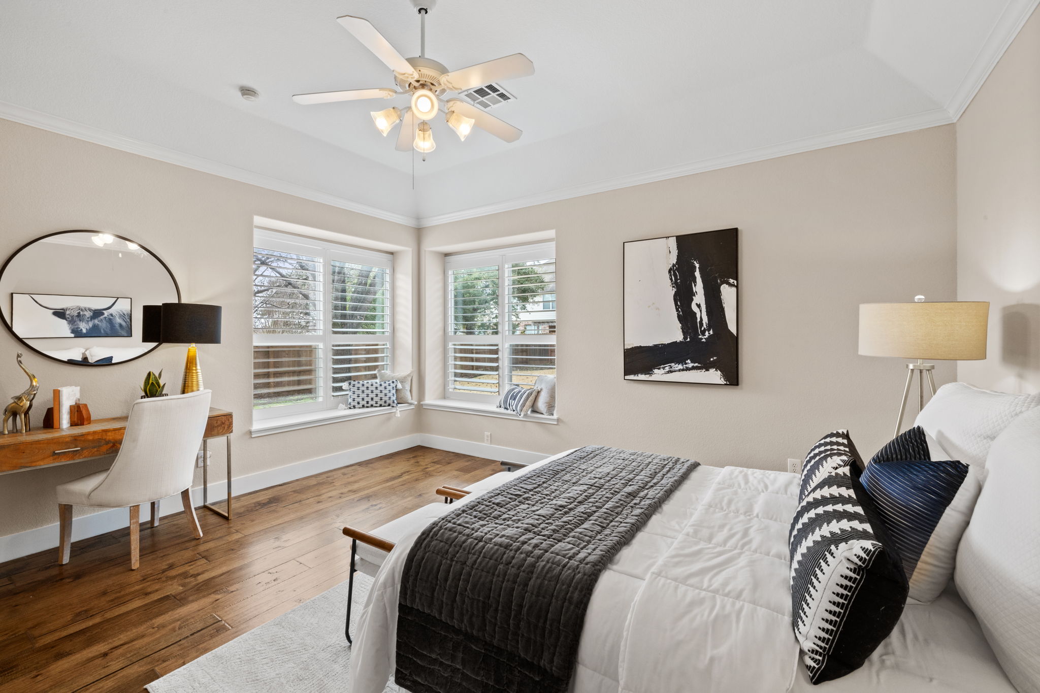 8112 Cobblestone Austin, TX 78735 - Photo 21 of 33 Bedroom with wood finished floors, a tray ceiling, ornamental molding, and a ceiling fan