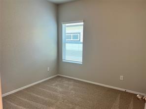 13309 Riding Drive Manor, TX 78653 - Photo 21 of 34 2nd bedroom on the hallway.