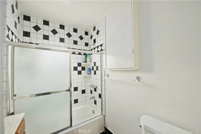 a bathroom with a bathtub and shower
