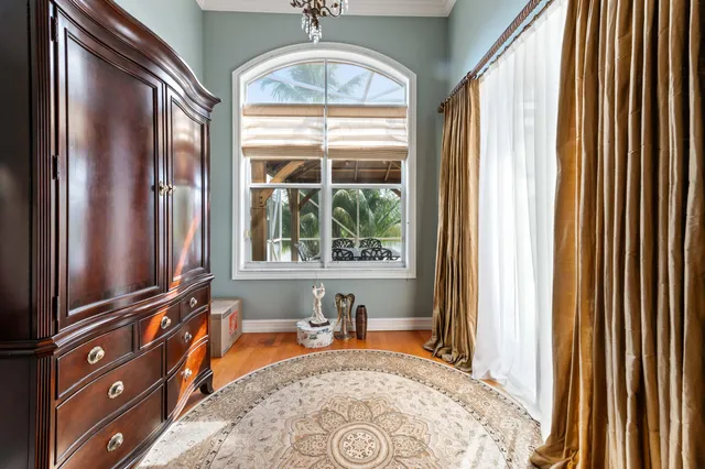 a spacious bathroom with a sink a large mirror and a bathtub next to a window