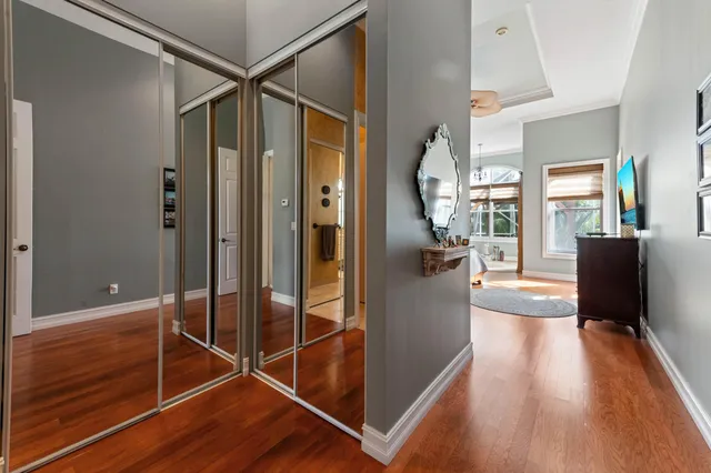 a white bath tub sitting in a bathroom next to a window