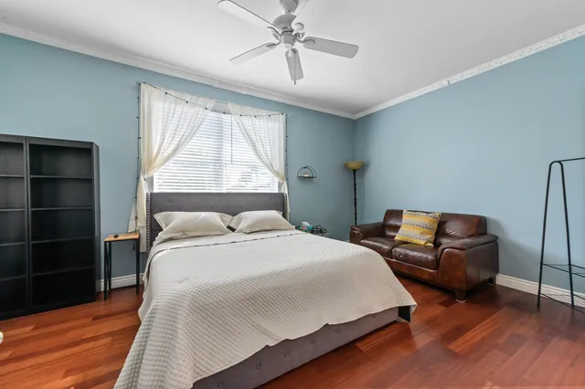 a bedroom with a bed and window