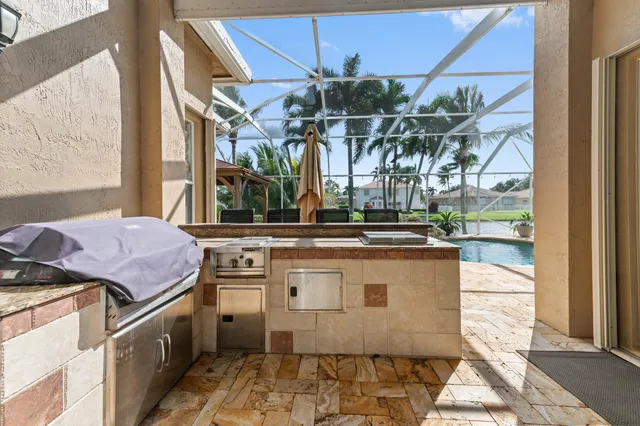 an aerial view of residential houses with outdoor space and swimming pool