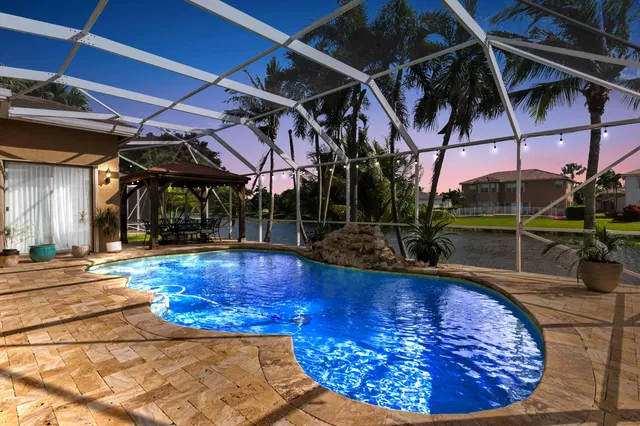 a view of a swimming pool with a patio