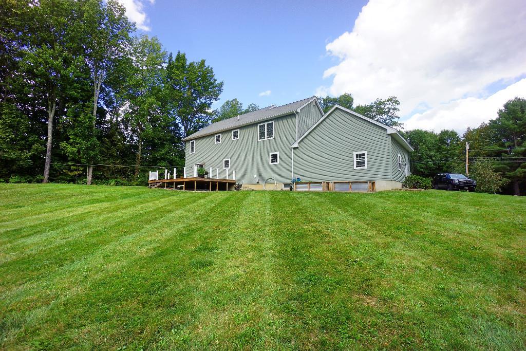 75 Shaw Hill Road Hampden, ME 04444 - Photo 33 of 35 Back of home with beautiful backyard.