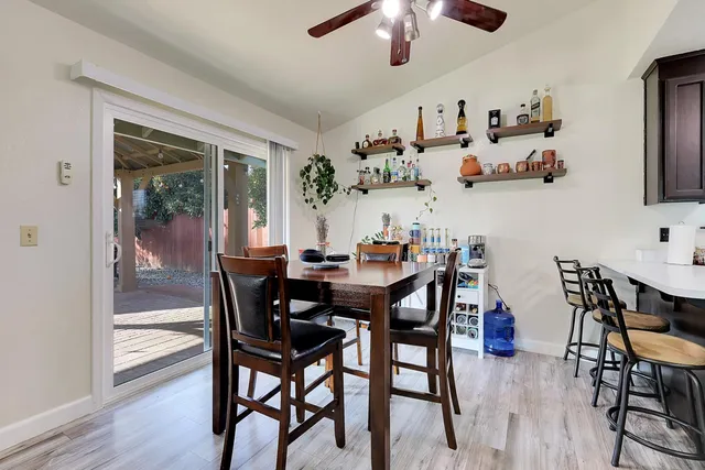 a view of a dining room with furniture wooden floor and chandelier