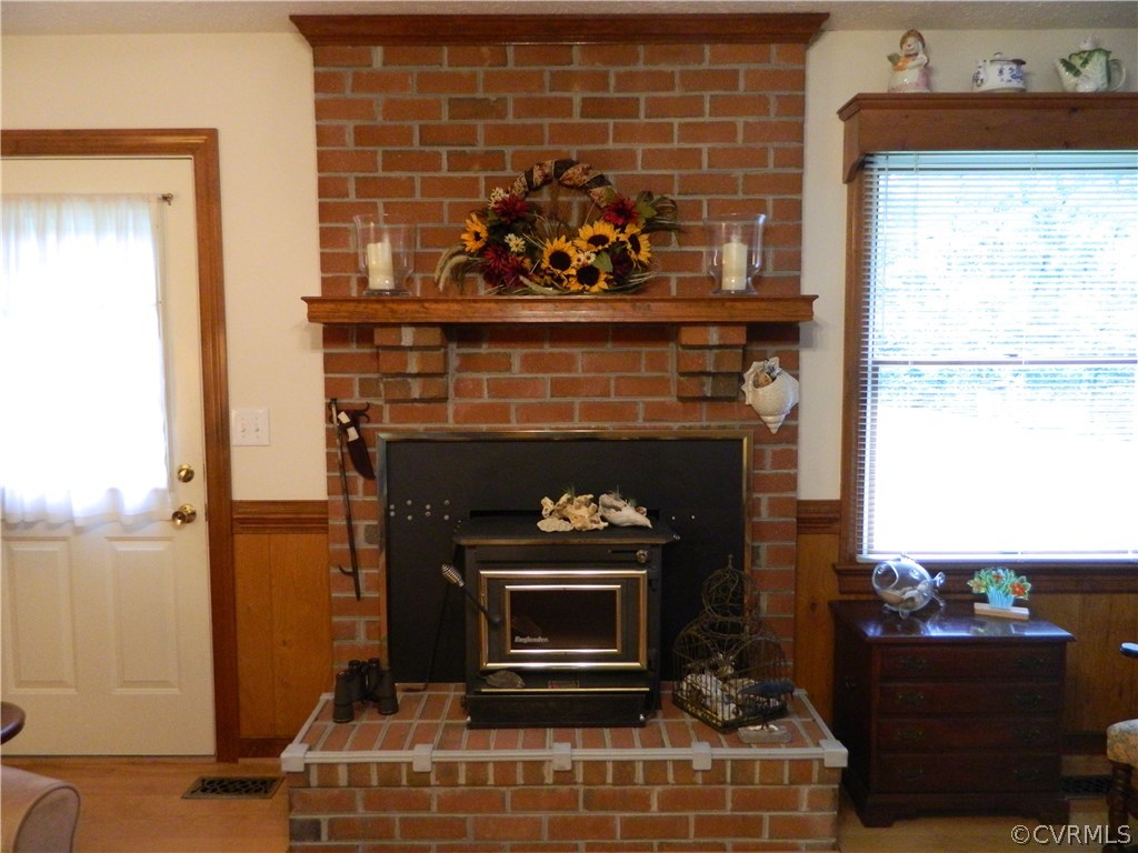 22929 King William Road West Point, VA 23181 - Photo 5 of 23 Brick fireplace with hearth and wooden mantle