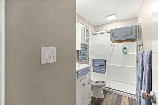 a bathroom with a toilet and a shower