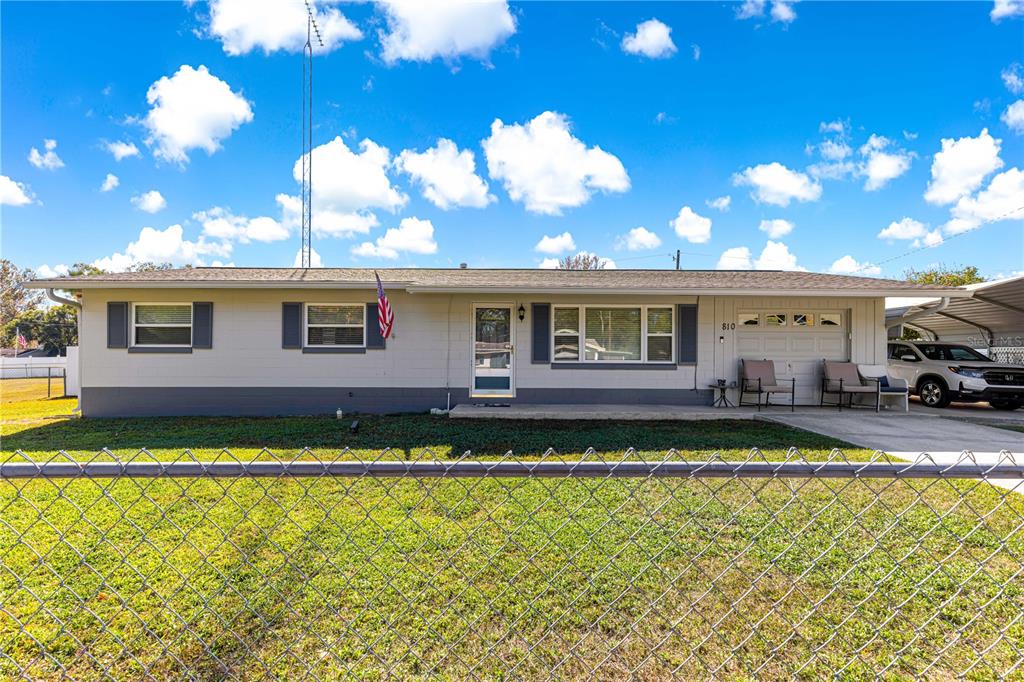 810 Northeast 44th Street Ocala, FL 34479 - Photo 2 of 44 a view of a house with swimming pool having outdoor seating
