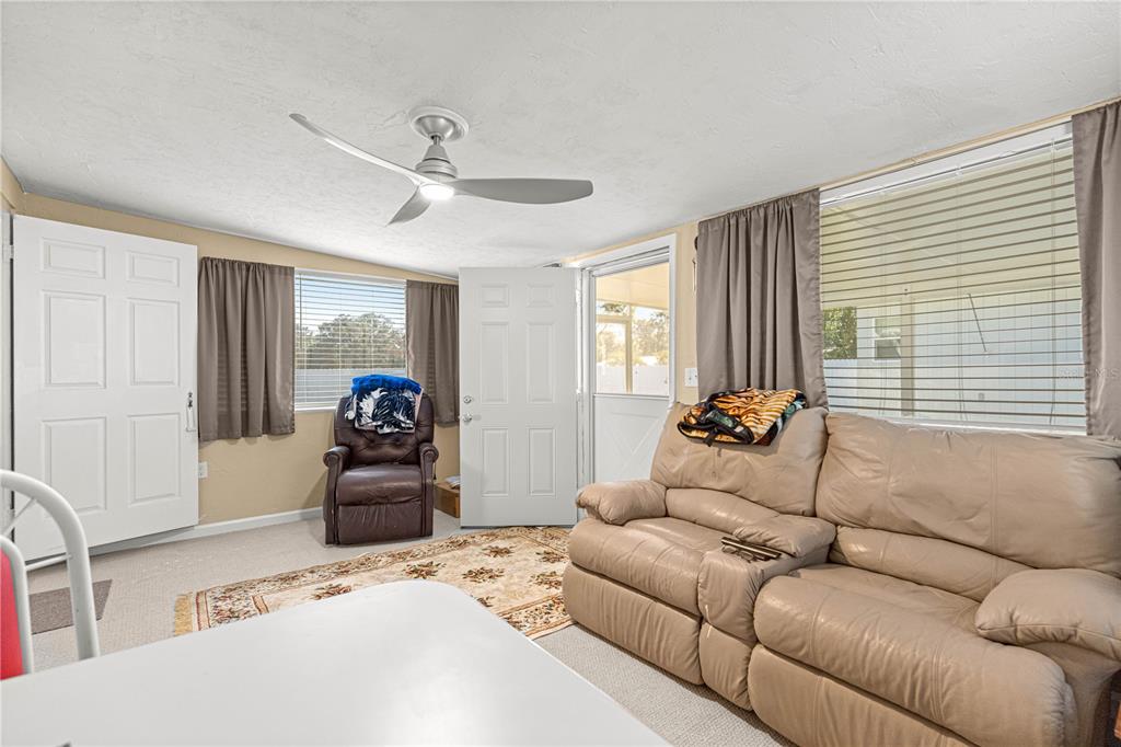 810 Northeast 44th Street Ocala, FL 34479 - Photo 27 of 44 a living room with furniture and a window