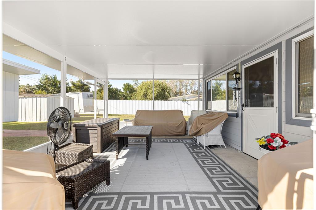 810 Northeast 44th Street Ocala, FL 34479 - Photo 30 of 44 a living room with furniture fireplace and large windows