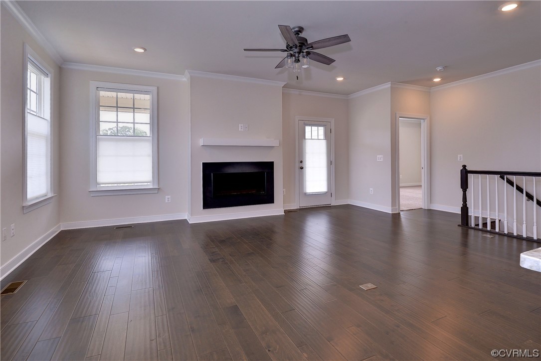 3975 Isaac Circle Williamsburg, VA 23188 - Photo 24 of 36 a view of an empty room with wooden floor fireplace and a window