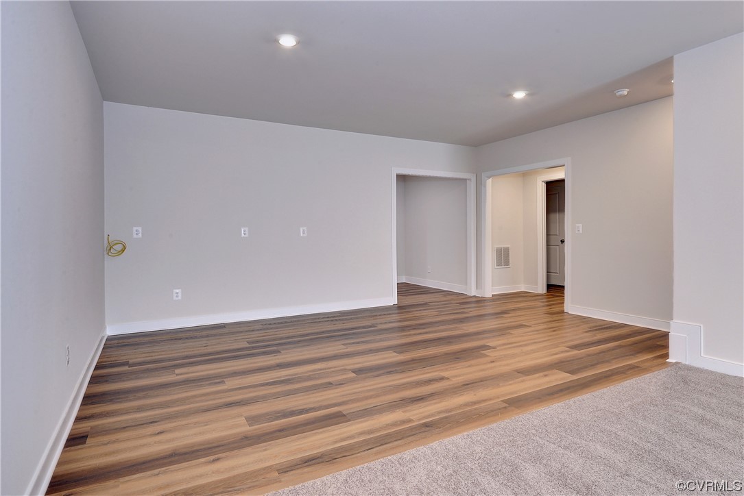 3975 Isaac Circle Williamsburg, VA 23188 - Photo 28 of 36 a view of an empty room with wooden floor and entryway