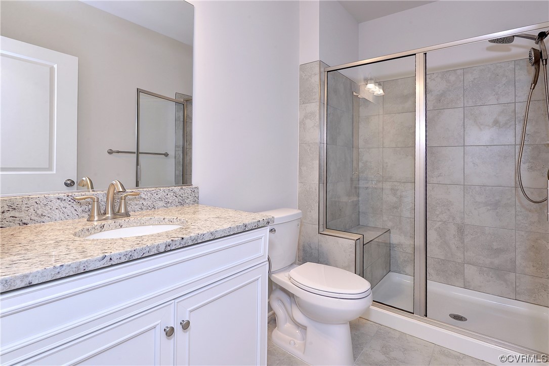 3975 Isaac Circle Williamsburg, VA 23188 - Photo 34 of 36 a bathroom with a granite countertop sink toilet and shower