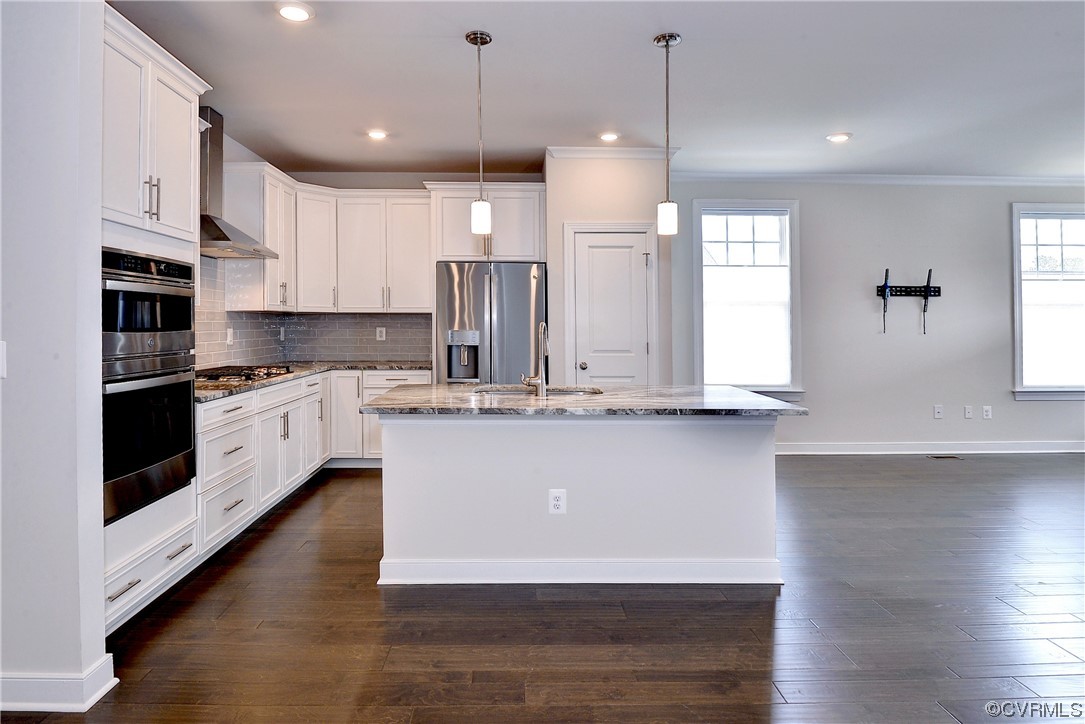 3975 Isaac Circle Williamsburg, VA 23188 - Photo 4 of 36 a large kitchen with granite countertop a large counter top space a sink stainless steel appliances and cabinets