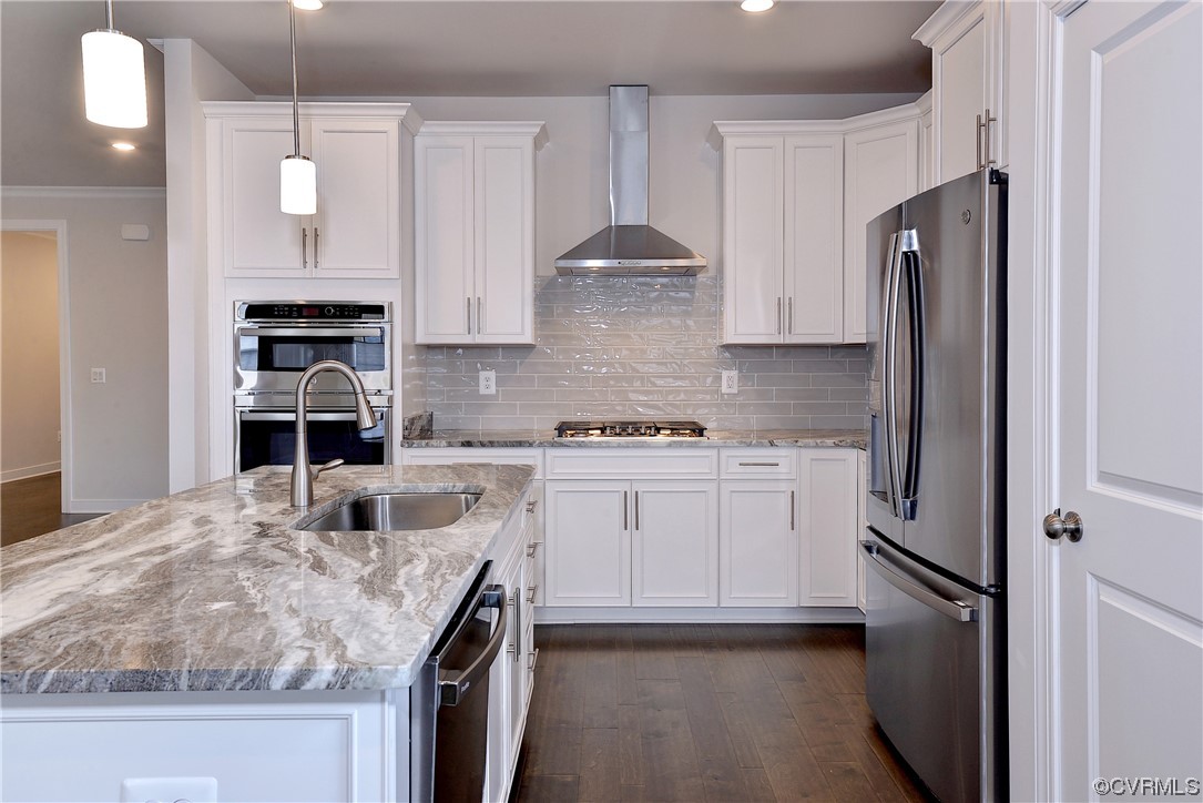 3975 Isaac Circle Williamsburg, VA 23188 - Photo 5 of 36 a kitchen with stainless steel appliances granite countertop a sink stove and refrigerator
