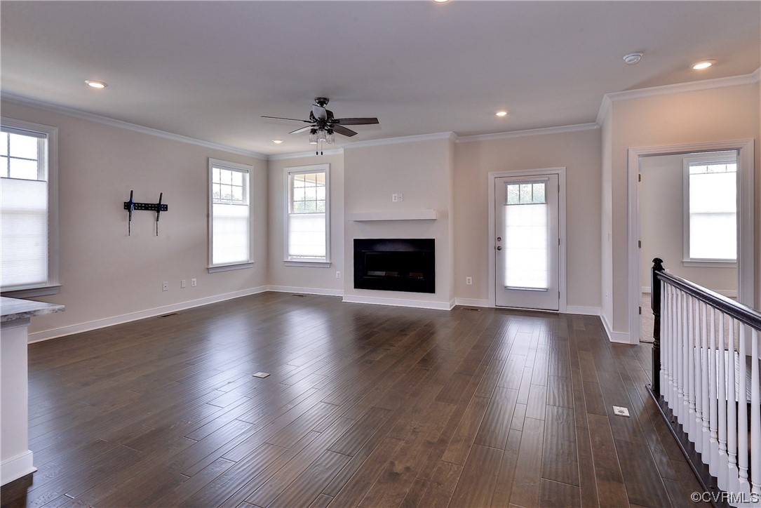 3975 Isaac Circle Williamsburg, VA 23188 - Photo 10 of 36 an empty room with wooden floor fireplace and windows