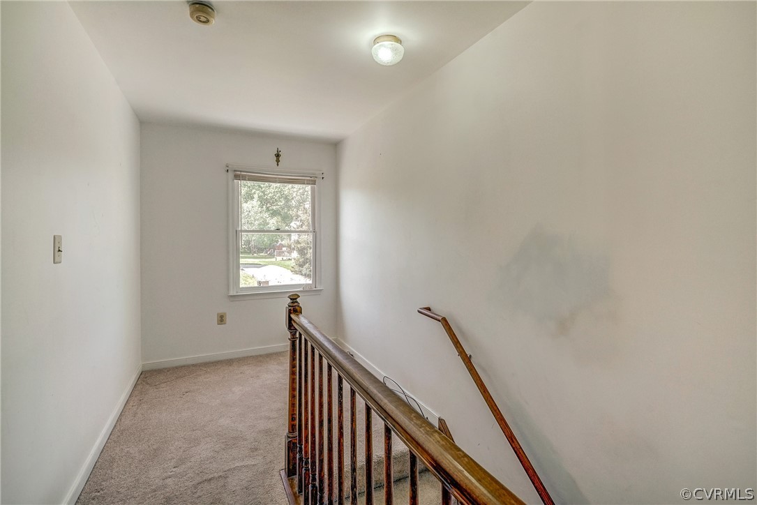 5212 Gatebridge Road Richmond, VA 23234 - Photo 21 of 47 a view of a hallway with window