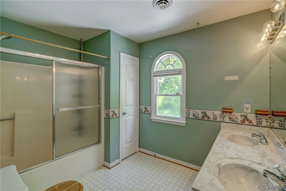 5212 Gatebridge Road Richmond, VA 23234 - Photo 28 of 47 a view of a bathroom with a tub shower and sink