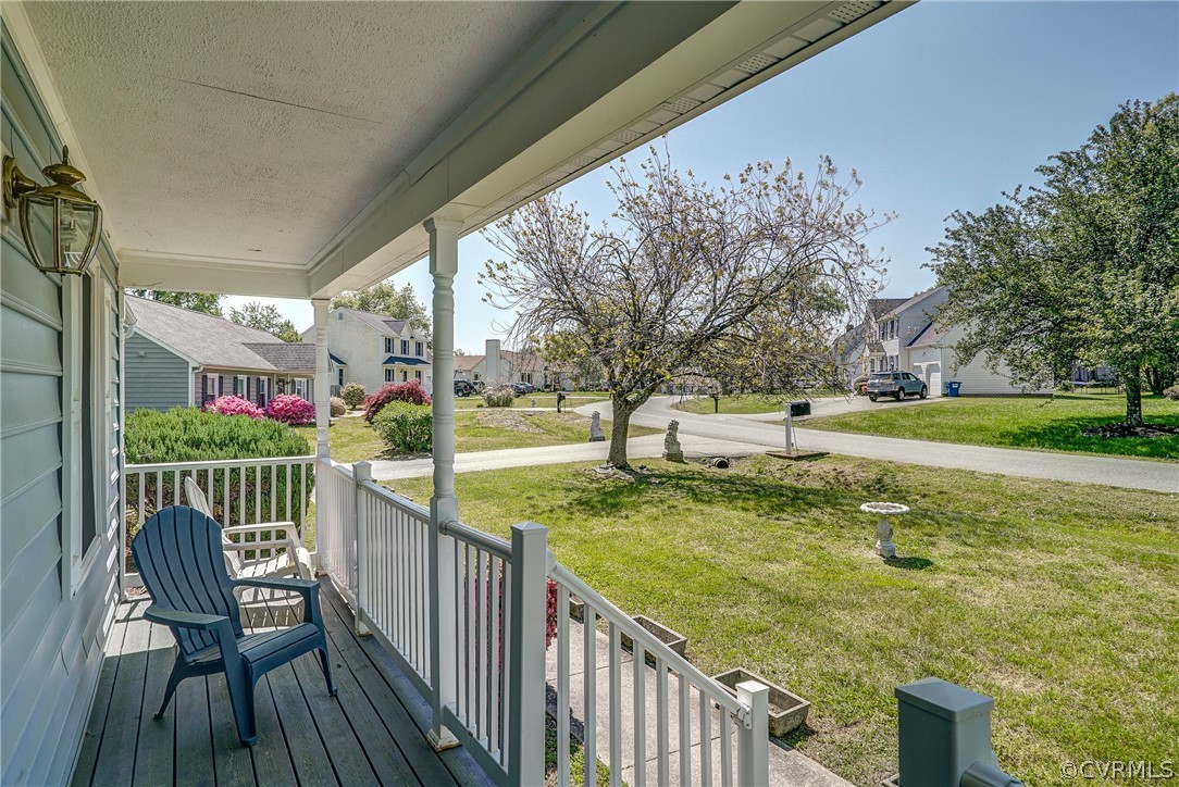 5212 Gatebridge Road Richmond, VA 23234 - Photo 5 of 47 a view of a patio with chairs and a table with potted plants