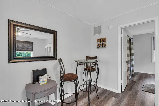 a view of a livingroom with furniture and wooden floor