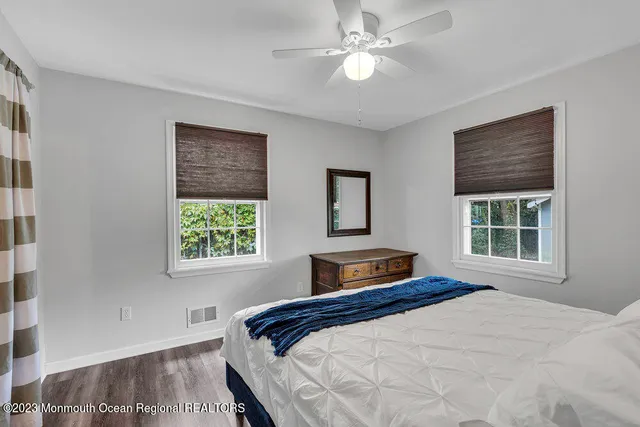 a bedroom with a large bed and a window