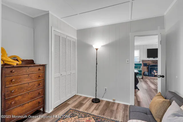 a living room with furniture and a flat tv screen