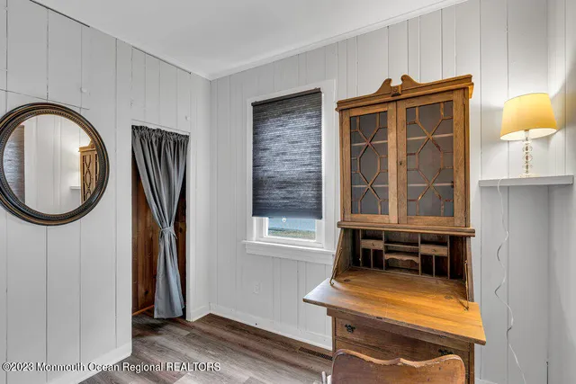 a bathroom with a sink a mirror and a window