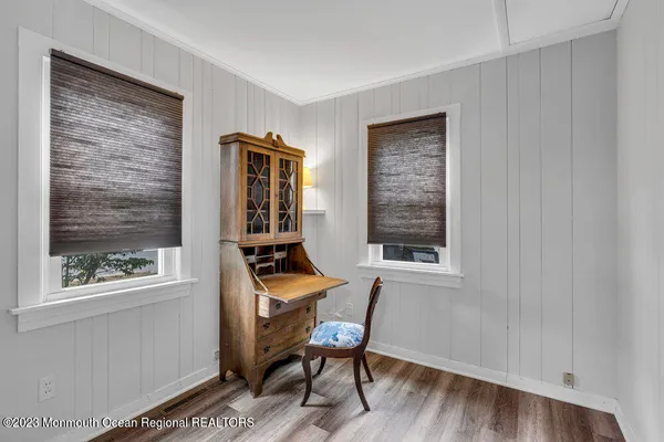 a room that has a window and a chair