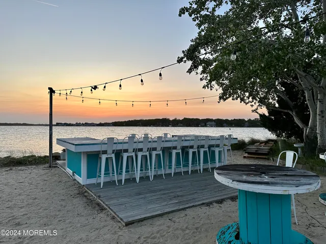 a view of lake with wooden floor