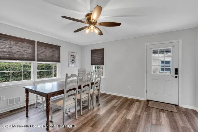 a view of a dining room with furniture and window